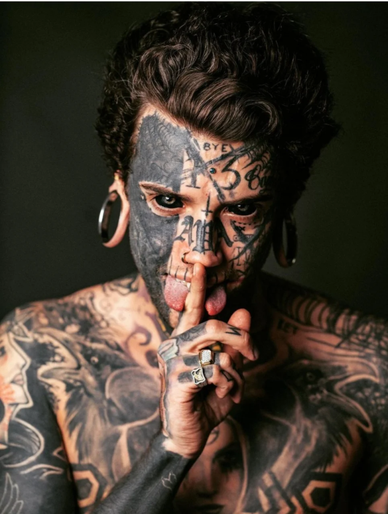 A 24-year-old man with many tattoos removes them for his kid.